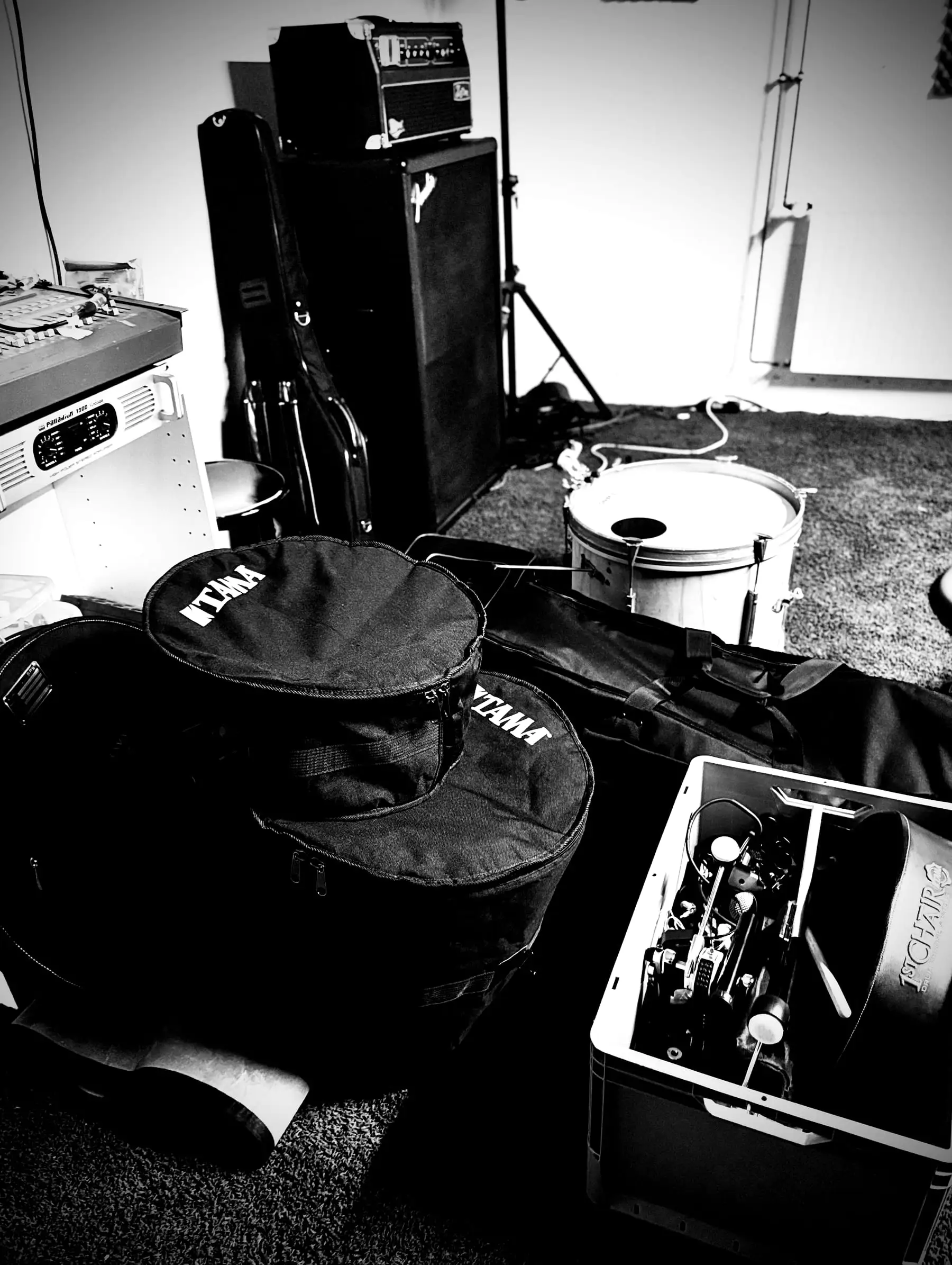 Load-in: gear being carried into the rehearsal room
