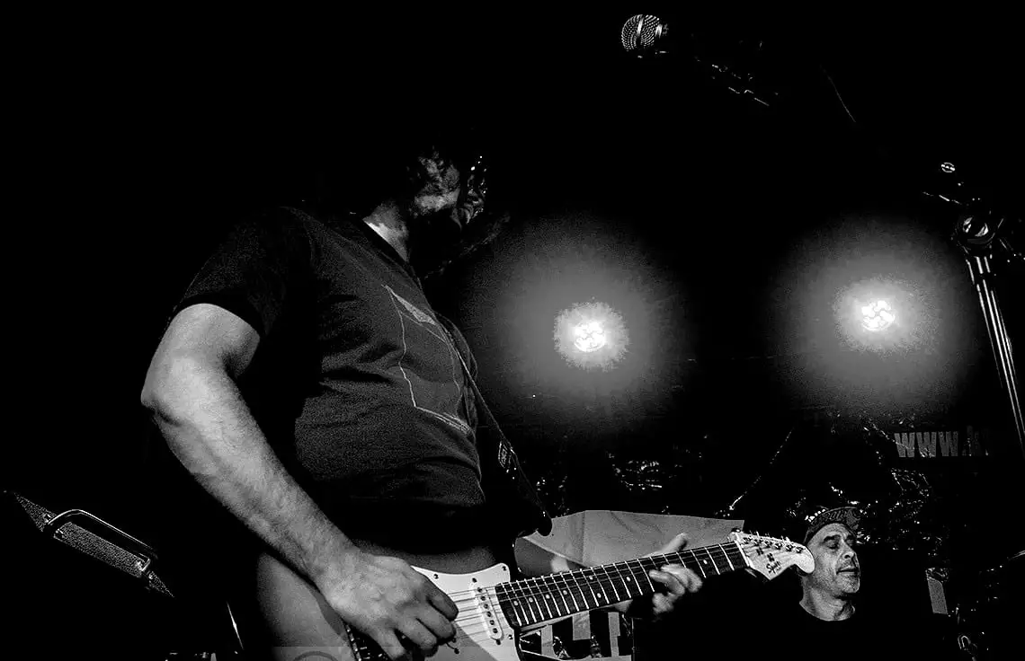 Low-angle stage shot with two glowing spotlights